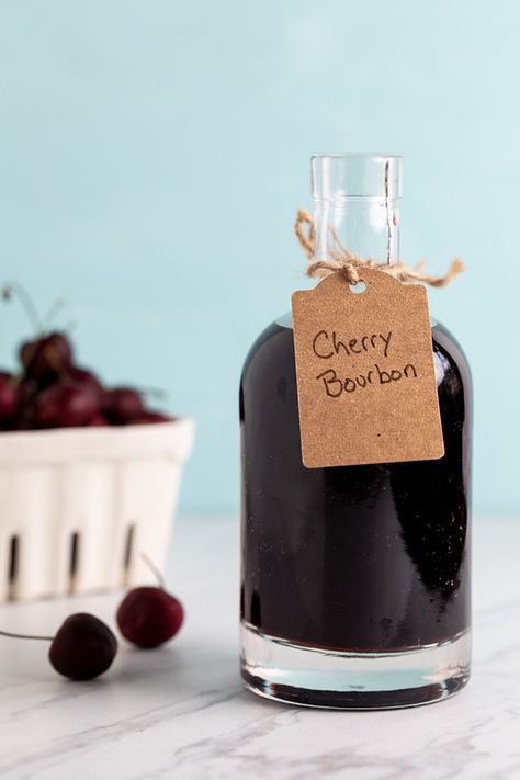 Cherry Bourbon - oh my this is the most delicious infused bourbon ever!! Sweet and spicy and perfect for cocktail, though I even like sipping it all by itself! Make a few batches because it makes a great gift!! #cherrybourbon #cherrywhiskey Homemade Liqueur, Infused Bourbon, Cherry Whiskey, Cherry Bourbon, Bourbon Liquor, Infused Liquors, Spicy Candy, Bourbon Cherries, Homemade Limoncello