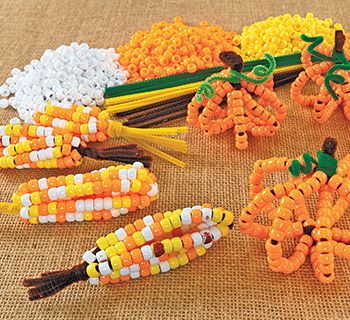 Pony Bead Corn & Pumpkins – Colorations® Pony Bead Pumpkin Craft, Corn Made Out Of Beads, Pony Bead Corn Cob, Corn Prek Activities, Pumpkin Pony Bead Craft, Preschool Bead Crafts, Corn Cob Painting, Thanksgiving Beaded Crafts, Bead Pumpkin Craft