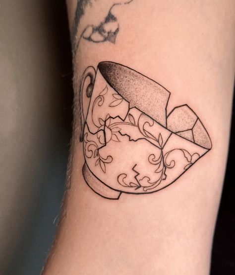 little cracked teapot on the arm, really enjoyed this one 🌝 thank you @_saintsuzanne_ 🫰 Shattered Teacup Tattoo, Alice Teacup Tattoo, Disney Teacup Tattoo, Tea Kettle Tattoo, Tea Tattoo Ideas, Tea Bag Tattoo, Teabag Tattoo, Cup Of Tea Tattoo, Tea Tattoos