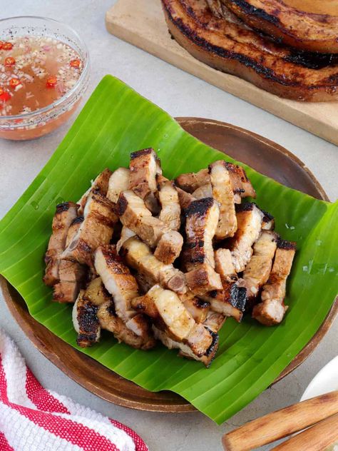 Filipino-style grilled pork belly marinated in citrus juice, fish sauce, and spices. It's juicy, flavorful, and makes a great appetizer or main dish. Kwek Kwek Recipe, Grilled Pork Belly, Gluten Free Fish, Sweet Bbq Sauce, Taco Rice, Pork Roll, Filipino Style, Pig Roast, Barbecue Pork