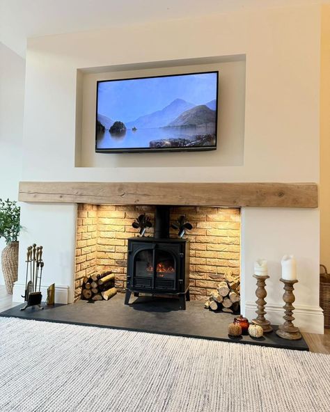 A lovely customer of ours @angels_home_ has a real eye for interior design and has kindly shared this photo. This is what Lisa has done with her stunning fireplace. The oak mantel beam and slate hearth are from Reclaimed World and it has been lit beautifully to make a magnificent focal point. We supply a variety of oak, pine and pitch pine beams in various lengths. Our joiner Oliver, treats and finishes all our beams to a high standard. New England Style Living Room, White Cottage Interiors, Living Room Design Green, Oak Beam Fireplace, Mantel Beam, Beam Fireplace, Oak Mantel, Pitch Pine, Slate Hearth