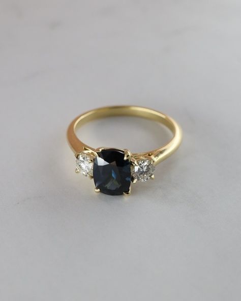 Talk about a Trilogy engagement ring 😍 This absolutely one-of-a-kind Elongated Cushion centre Teal Sapphire with Round diamond side… | Instagram Teal Sapphire Engagement Ring, Trilogy Engagement Ring, Side Stone Engagement Ring, Wedding News, Engagement Ring Wedding Band, Engagement Rings Sapphire, Sapphire Ring, Round Diamonds, Wedding Bands