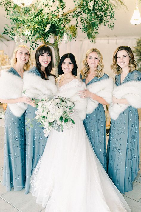 Read More: https://www.stylemepretty.com/2020/04/16/luxury-winter-wedding-complete-with-steal-worthy-gray-blue-bridesmaid-dresses/ Grey Blue Bridesmaid Dresses, Wedding Fur Shawl, Fur Bridal Wrap, Metallic Bridesmaid Dresses, Winter Bridesmaid, Christmas Wedding Dresses, Faux Fur Bridal Wrap, Winter Wedding Bridesmaids, Queen Wedding