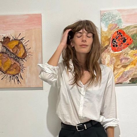 Emily Labowe on Instagram: "I was in my first group show sharing a couple of my paintings ! Show will be up for one week. Dm for inquiry. Thank you @hellomrdavid & @_sad_studios for including me— alongside some very talented female artists 💕 & to everyone who came to support. New series & pieces coming soon.. 🖤 Also thank you to @soeur_paris for my new and only pair of pants I will be wearing 🖤 #emlabowe___art" Emily Labowe Hair, Emily Labowe Style, Emily Labowe, January 2025, Blouse Style, Long Hair With Bangs, Fall 2024, Pair Of Pants, New Series