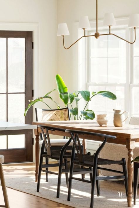 Check out this transitional dining room inspiration and ideas including decor, chandelier and lighting, table, chairs. This spacious and light dining room features a beautiful dark wood dining room table with black cane wrapped chairs. Get morem dining room design ideas at www.stonehousecollective.com Light Wood Table Dark Wood Chairs, Traditional Dining Table Modern Chairs, Light Table Dark Chairs, Dark Dining Table Light Chairs, Dark Wood Floor Dining Room, Modern Colonial Dining Room, Transitional Dining Room Inspiration, Dark Wood Dining Room Table, Colonial Dining Table