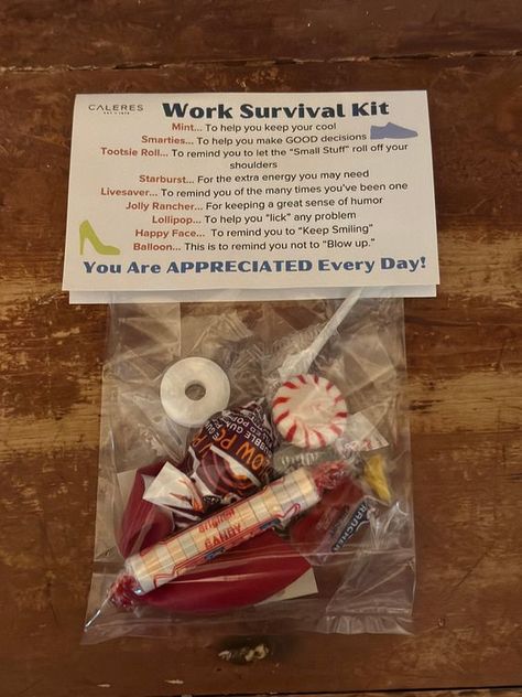 Brighten your coworkers' day with our charming Work Survival Kits! Each kit is thoughtfully curated with a variety of candies and sweet, motivational messages designed to bring a smile to anyone's face. Perfect for welcoming new team members, celebrating achievements, or just spreading a little cheer around the office! What's Inside: *Balloon: "To remind you not to blow up." *Life Savers: "To remind you of the many times you've been one!" *Lollipop: "To help you "lick" any challenge. * Smarties: "To help you make those smart decisions." * Happy Face Sticker: "To remind you to keep smiling."  *Starburst: "To give you a burst of energy." *Peppermint: "To keep your cool in stressful times." *Jolly Rancher: "For keeping a great sense of humor." * Tootsie Rolls: "To help you roll with the punch Motivation For Coworkers, Bulk Coworker Gifts, Survival Kit Gifts For Coworkers, Retail Survival Kit Ideas, New Coworker Welcome Gift, Coworker Survival Kit, Candy Survival Kit Ideas, Survival Kits For Coworkers, Work Survival Kit Ideas