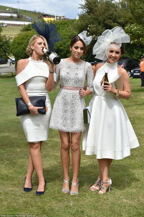 Someone's thirsty! Three glamorous women dressed in classy hues of silver and white pose f... White Dress And Fascinator Outfit, Polo Day Outfit, White Kentucky Derby Outfit, White Tea Party Outfit, Races Outfits For Women, White Outfits For Women Party Classy, Tea Party Outfits For Women Classy, Fascinator Outfit, Kentucky Derby Outfit For Women