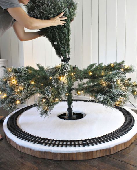 A DIY tutorial to build a Christmas tree skirt for a train. Make a safe place for the train tracks under the tree with this Christmas tree skirt. #treeskirt Track Skirt, Christmas Tree Village Display, Diy Christmas Tree Skirt, Christmas Tree Train, Christmas Tree Village, Christmas Village Houses, Christmas Village Display, Christmas Things, Christmas Train