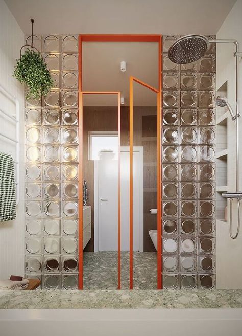 Discover this stunning bathroom designed by Framuga Studio in Poland | Featuring Alpha clear glass blocks and sleek aluminum doors with clear glass, this space creatively separates the wet and dry zones. The design balances warm wood tones, greenery, and beige hues with bold geometric shapes, incorporating squares, sage, walnut, and a striking orange frame | #bathroomdesign #boldinteriordesign #geometricstyle #glasspartition #modernbathroom #glassblock #glassbrick Modern Art Deco Bathroom, Best Bathroom Paint Colors, Bold Bathroom, Bathroom Paint, Deco Bathroom, Bathroom Paint Colors, Glass Blocks, Contemporary Home Decor, Art Deco Era