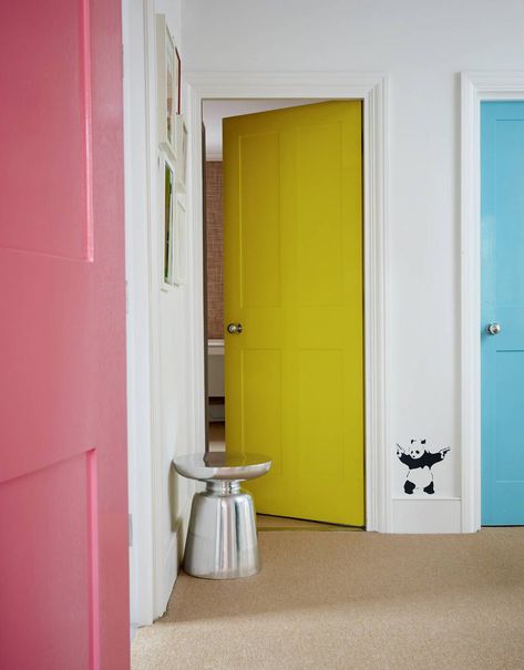 In this project, the interior designer [link url="https://www.houseandgarden.co.uk/article/henri-fitzwilliam-lay-house"]Henri Fitzwilliam-Lay[/link] had the doors of three children’s rooms painted in different pastel colours to make the landing feel ‘playful and whimsical’. This would work equally well in a more grown-up space, using darker or more muted tones. It is a clever way to perk up a small area in which the opportunities for decorating are more limited. Painted Hallway Doors, Colored Doors Interior, Paint Doors Interior, Painted Bedroom Doors, Colourful Rooms, Interior Door Color, Colored Doors, Interior Door Colors, Hallway Door