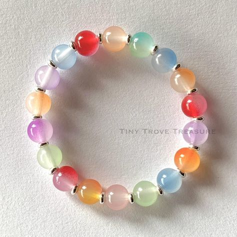 The Rainbow-Hued Bracelet Mixed Color Classic Glass Imitation Jade Beads Bracelet- Glass Bead Bracelet- 8mm - Spring, Rainbow, Unisex, Easter, Colourful Bracelet @tiny.trove.treasure The Mixed Color Classic Glass Imitation Jade Beads Bracelet is a stunning testament to artistry and sophistication. Each bead is carefully selected and arranged to create a mesmerizing fusion of colors and textures. Whether worn casually or for a special occasion, it is sure to draw admiration and become a che... Colourful Bracelet, Spring Rainbow, Glass Beaded Bracelets, Jade Beads, Colorful Bracelets, Beads Bracelet, Bead Bracelet, Glass Bead, To Draw