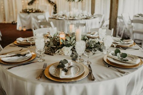 The reception decor for Mitch and Linea's wedding Eucalyptus Wedding Tables, Gold Charger Plates Wedding, Gold And Greenery Wedding, Wedding Dinner Table Setting, Round Table Settings, Wedding Plate Setting, Neutral Wedding Decor, Plates Ideas, Plates Design