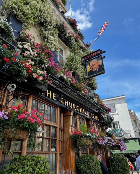 Happiness is a trip to London. One of our favorite evenings was walking from our AirBNB in Kensington to @churchillarmsw8 to watch Scotland vs. Switzerland in the Euro Cup with some locals. After all of the times we’ve visited London, this was actually our first pub we’ve been to! I tried my first @fullers 🍺 Quite a historic first too. The Churchill Arms is one of London’s most iconic and historic pubs. Dating back to 1750, this beloved establishment is famously adorned with an impressive ... The Churchill Arms London, Euro Cup, London Kensington, Trip To London, London Pubs, Green Queen, 2025 Vision, Visit London, London Travel