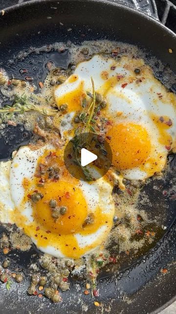 Gill Meller on Instagram: "Celebrating #worldeggday with my fav fried eggs! You have to try this, wherever you are today. 

Fried eggs with anchovies, capers, chili, butter and thyme..

This is one of my absolute favorite fried egg hacks. The combination of flavours is just so good. Here’s how it comes together..

Ingredients 

2 organic or free range eggs
4 to 6 salted anchovy fillets.
2 teaspoons of capers.
A few sprigs of fresh thyme or rosemary.
A decent knob of butter.
Sea salt and freshly ground black pepper.
Bread for toasting.

Set a heavy base pan down over a medium high heat. Add a small trickle of olive oil and when it’s hot, add the anchovy fillets. Sizzle them in the oil for 30 to 40 seconds then add the capers, chili flakes and thyme sprigs. Drop in the butter and when it is How To Fry An Egg Over Medium, Chili Oil Fried Eggs, Fried Spaghetti And Eggs, Gill Meller, Fried Egg Yolk, Fried Sunny Side Up Eggs, Black Pepper Bread, Pepper Bread, Chili Butter