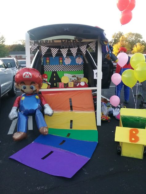 Mario kart trunk or treat Super Mario Cart Trunk Or Treat, Mario Kart Golf Cart, Mario World Trunk Or Treat, Easy Mario Trunk Or Treat, Mario Kart Trunk Or Treat Ideas For Cars, Mario Halloween Trunk Or Treat, Mario Kart Rainbow Road Trunk Or Treat, Mario Party Trunk Or Treat, Trunk Or Treat Mario Kart