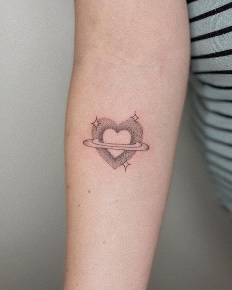 Top 100 Best Saturn Tattoos For Women - Planet Design Ideas Saturn Heart Tattoo, Saturn Symbolism, Saturn Tattoo, Planet Tattoos, Planet Design, Adventurous Women, Dope Tattoos For Women, Space Tattoo, Sky Design