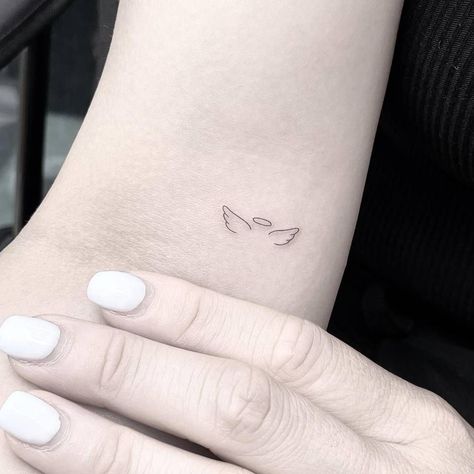 Angel Tattoo Simple Tiny, Tattoo Halo Angel, Minimalist Angel Tattoo Wings, Subtle Angel Tattoo, Minimalist In Memory Tattoo, Angle Wings Tattoo Tiny, Angel Tattoo For Women Minimalist, Angel Tattoo With Initials, Initials With Angel Wings Tattoo