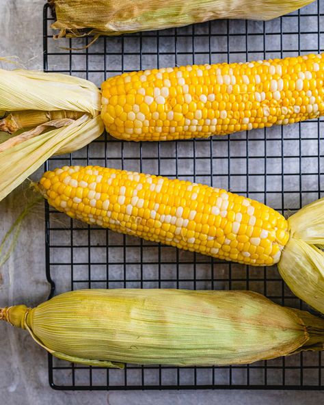 This oven roasted corn on the cob is the easy way to cook corn! You don't even have to remove the husk; just throw it right onto the oven grates. #corn #cornonthecob #cob #oven #corninoven #sidedish #easy Roasted Corn On The Cob, Corn In The Oven, Oven Roasted Corn, Cook Corn, Cob Oven, Best Fish Recipes, Winter Salad Recipes, A Couple Cooks, How To Cook Corn