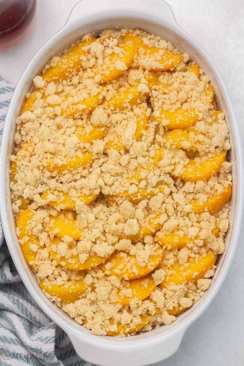 An easy Overnight French Toast Casserole topped with peach cobbler — it's the BEST French toast I’ve ever had! So perfect for Spring, it's full of juicy peaches and a sweet, moist crumb topping! #peaches #recipe | breakfast recipe | brunch ideas | easter brunch | canned peaches | fresh peaches | french toast casserole Brunch Ideas Easter, Peach Cobbler French Toast, Easy Overnight French Toast, Peach French Toast, Overnight French Toast Casserole, The Best French Toast, French Toast Casserole Overnight, Best French Toast, Overnight French Toast