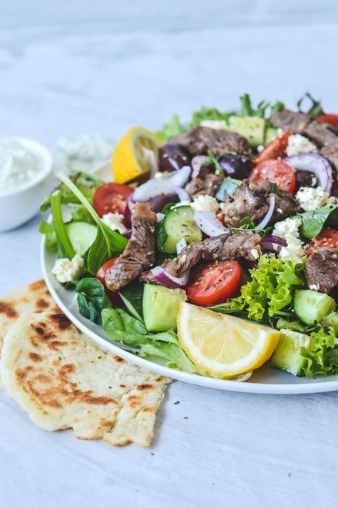 For a fast, simple and healthy family dinner that is absolutely packed with flavour, try this Greek lamb salad recipe! Marinated grilled lamb served warm with a drizzle of fresh tzatziki turns this classic Greek salad into something truly special. And the whole dish can be on your table (from scratch) in just 15 minutes! Recipe With Tzatziki, Classic Greek Salad, Healthy Family Dinner, Recipes With Cool Whip, Lamb Salad, Amazing Salads, Greek Lamb, Marinated Lamb, Homemade Tzatziki