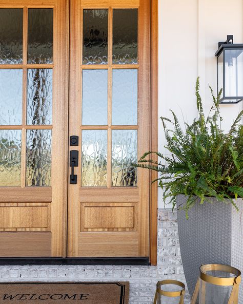 Your front door serves as the focal point for your home's exterior. Whether it's a rich stained wood, a vibrant splash of color, or an intricate design with decorative glass, the choices are endless! Windows Above Front Door Entryway, Colonial Front Door, Front Door Entryway, Door Entryway, Front Door Design, Glass Front Door, Stained Wood, Decorative Glass, Gray Design