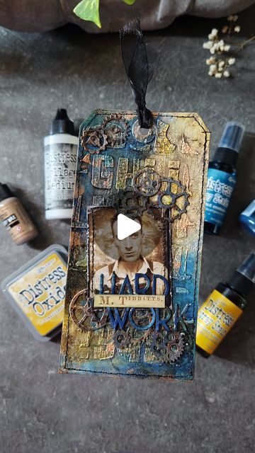 Ranger Ink (Official) on Instagram: "Watch @scrapsaurus as she immerses herself in the artistry of creating this masculine tag with a grunge-infused background. Embrace the rugged charm of weathered texture incorporating Distress Sprays, Crayons, and Paint from the @tim_holtz Distress Line.  🖤     Supplies: 🔹Tim Holtz Distress® Spray: Uncharted Mariner, Fossilized Amber 🔹Tim Holtz Distress® Oxide Spray: Uncharted Mariner 🔹Tim Holtz Distress® Flip Top Paint: Black Soot, Ground Espresso 🔹Tim Holtz Distress® Crayon: Uncharted Mariner, Fossilized Amber 🔹Tim Holtz Distress® Texture Paste: Crackle 🔹Tim Holtz Distress® Sprayer 🔹Tim Holtz® by Tonic Studios Surface Media Mat 🔹Tim Holtz Distress® Micro Glaze™ 🔹Tim Holtz Distress® Foundry Wax Kit #2 Sterling/Statue 🔹Ranger Heat It™ Craft T Tim Holtz Distress Crayons, Tim Holtz Mixed Media, Stunning Backgrounds, Saltwater Taffy, Wildflower Photo, Distress Crayons, Tim Holtz Distress Ink, Blending Tools, Collage Techniques