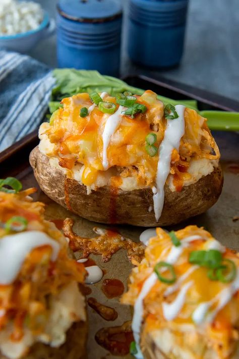 Cheesy Buffalo Chicken Baked Potatoes | Ranch Twice Baked Potatoes Chicken Stuffed Potatoes, Chicken Baked Potato, Cheesy Buffalo Chicken, Buffalo Chicken Tacos, Chicken Potato Bake, Chicken Stuffing, Stuffed Potatoes, Stuffed Baked Potatoes, Baked Buffalo Chicken