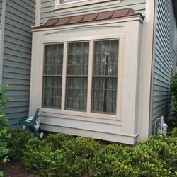 Marvin Integrity Box Bay window with copper roof in Aurora , IL.   Installed by Ultimate Home Solutions.  Live nearby?  Call Ultimate Home Solutions for a free in-home estimate at 630-469-5400. Recipient of the Better Business Bureau “Complaint Free Award”. Bow Window Exterior Ideas, Copper Bay Window, Metal Roof Over Bay Window, Copper Roof Over Bay Window, Boxed Bay Window Exterior, Red Brick House Exterior Bay Window, Bay Window Replacement, Polo House, Brown Roof Houses