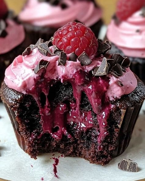 Raspberry Chocolate Lava Cupcakes 🍫🍇 Ingredients: For the Cupcakes: - 1/2 cup unsalted butter - 6 oz semi-sweet chocolate, chopped - 1/4 cup granulated sugar - 2 large eggs - 1/4 cup all-purpose flour - 1 tsp vanilla extract - 1/4 cup raspberry preserves For the Filling: - 6 fresh raspberries - 2 oz dark chocolate, chopped For the Topping: - Powdered sugar (for dusting) - Fresh raspberries Instructions: 1. Preheat the oven to 425°F and grease a muffin tin or line with cupcake liners. 2.... Dark Desserts, Chocolate Lava Cupcakes, Lava Cupcakes, Raspberry Cupcakes, Raspberry Chocolate, Raspberry Preserves, Chocolate Lava, Fresh Raspberries, Easy Baking Recipes Desserts