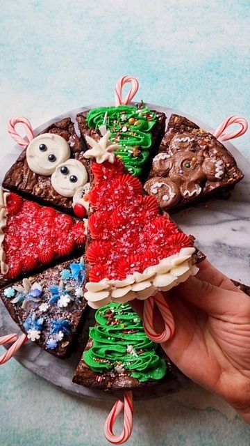 Sasha Nary / Aleksandra Naryzhny on Instagram: "New Christmas Brownie Pops!🍫☃️🎄 Decadent chocolate goodness with perfectly crinkly tops - these brownie slices are dressed in a variety of holiday classics to celebrate the holiday season! They were so much fun to put together for @Twisted, and are inspired by fall version of last year's! Instead of loved melted chocolate, I used my carton egg white swiss meringue buttercream, so good!😋 (recipe is in my cookbook) Brownie Slices Recipe Ingredients: 2/3 cup (130 g) granulated sugar 2/3 cup (135 g) dark brown sugar 3 eggs, room temperature 1/2 cup (113 g) unsalted butter 1 cup (100 g) dark chocolate chips/chunks 1/4 cup (54 g) vegetable oil 2 tsp vanilla 1/2 cup (75 g) all-purpose flour 1/2 cup (50 g) unsweetened cocoa powder 1 tbsp cornstar Christmas Brownie, Christmas Tree Brownies, Brownie Pops, Christmas Brownies, Dark Brown Sugar, Unsweetened Cocoa Powder, Meringue Buttercream, Swiss Meringue, Swiss Meringue Buttercream