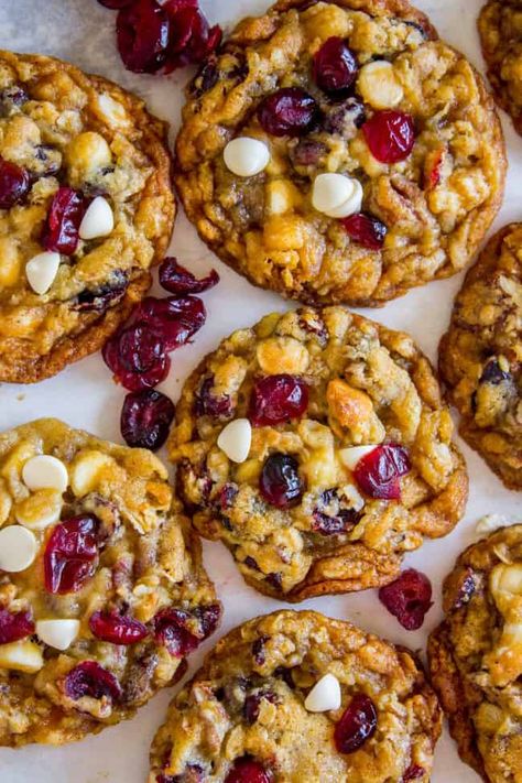 White Chocolate Cranberry Cookies from The Food Charlatan. These White Chocolate Cranberry Cookies have got it all: tons of white chocolate, juicy cranberries, chopped toasted pecans, flaked coconut, old fashioned oats, oh my! They are thick and chewy and slightly crisp on the edges with a moist and tender center. They are based on my Texas Cowboy Cookies, one of the most popular recipes on my blog! #whitechocolate #cranberry #cranberries #cookie #oats #oatmeal #butter #recipe #easy #christmas Texas Cowboy Cookies, Cranberry Cookie, Choc Cookies, Chocolate Cranberry Cookies, Cranberry Cookies Recipes, Cookie Holiday, Best White Chocolate, White Chocolate Cranberry Cookies, Cookie Balls