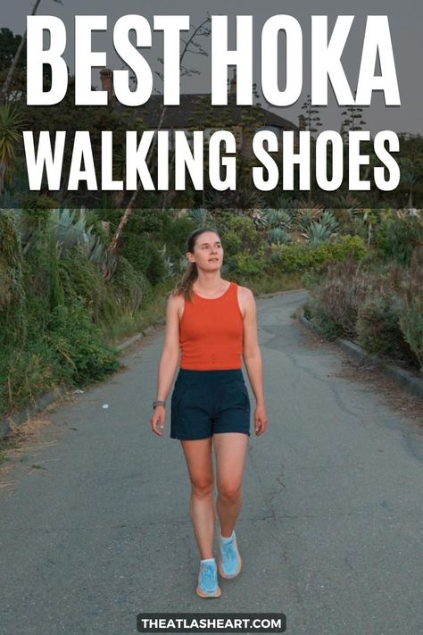 A young woman wearing light blue Hoka walking shoes, an orange tank top, and navy shorts walks towards the camera on a paved path lined by succulents and bushes, with the text overlay, "Best Hoka Walking Shoe." Hoka Walking Shoes Woman, Hoka Shoes Woman Outfit, Hoka Outfit, Hoka Shoes Woman, Walking Sneakers For Women, Shoes For High Arches, Best Shoes For Travel, Power Walking, Hoka Shoes