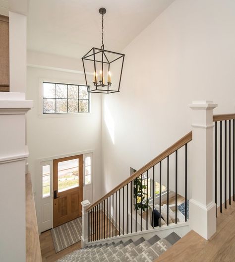 Raised Ranch Banister Ideas, Stair Railing Ideas Modern Farmhouse, Split Level Railing Ideas Half Walls, Stair Chandelier Farmhouse, End Of Hallway Picture Display, Entry Way Pendant Light, Classic Stair Railing Ideas, Transitional Style Staircase, Split Level Entryway Light Fixture