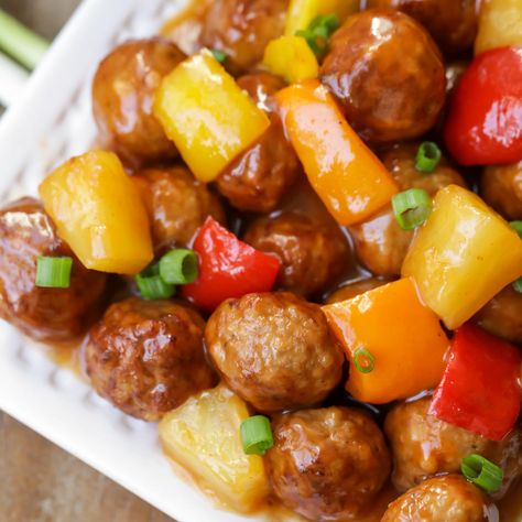 These Sweet and Sour Meatballs are made with frozen meatballs and pineapple chunks and are covered in a DELICIOUS homemade sweet and sour sauce!! It's the perfect appetizer or dinner idea served over rice or noodles. Sweet N Sour Meatballs, Sweet Meatballs, Pineapple Meatballs, Spaghetti With Ground Beef, Sweet And Sour Meatballs, Meatball Recipes Easy, Pork Meatballs, Meatball Ingredients, Frozen Meatballs