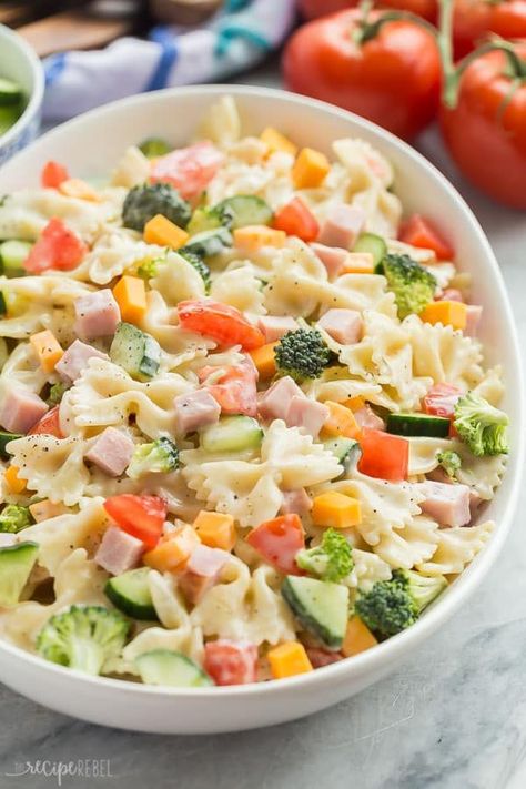 This Creamy Ranch Bowtie Pasta Salad is an easy summer side dish for your barbecue or cookout, or an easy dinner idea! The leftovers make a great cold lunch for school or work, and it keeps well in the fridge. Loaded with your favorite summer veggies and a creamy ranch dressing! #ranch #pasta #pastasalad #salad #barbecue #picnic Ranch Bowtie Pasta Salad, Ranch Vegetables, Recipes For School Lunches, Salad Ranch, Recipes For School, Cold Pasta Recipes, Salad Caesar, Lunch For School, Pasta Salad For Kids