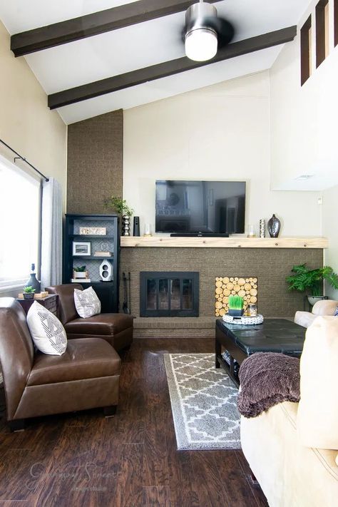 Casual Modern Family Room Makeover | ©GarrisonStreetDesignStudio | One Room Challenge | ORC | 2020 | Fall 2020 ORC | Week 1 | Plans | Design | Ideas | Family Room | Living Room | TV Room | Fireplace | Brick | Painted Brick | Open Concept | Tri Level Modern | Farmhouse | MCM | Mid-Century | Wood Floors | Mood Board | Crate and Barrel | Rug | Railing | DIY | Vaulted Ceilings | Faux Logs | Lamp | Decor | Inspiratioon | Makeover | Before | Decorating | With TV | Affordable | Cozy Modern Farmhouse Living Room Inspiration, Faux Logs, Modern Family Room, Family Room Reveal, Fireplace Brick, Diy Fireplace Makeover, Modern Family Rooms, Family Room Makeover, Room Fireplace