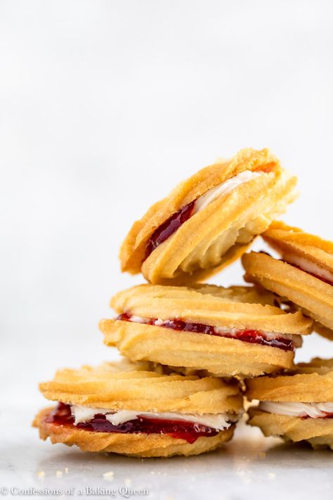 These delicate buttery cookies are filled with a simple buttercream and either raspberry or strawberry jam. These British biscuits are perfect for an afternoon treat. Viennese Whirls literally melt in your mouth, be prepared to fall in love with this British cookie! #viennessewhirls #butterbiscuits #britishbiscuitrecipe #englishcookies #howtomakeviennessewhirls Finger Biscuits, Viennese Sandwich Cookies, Vienna Fingers Dessert, Viennese Swirl Cookies, Filled Cookies Jam, British Biscuit Recipes, Viennese Biscuits, British Cookies, Viennese Whirls