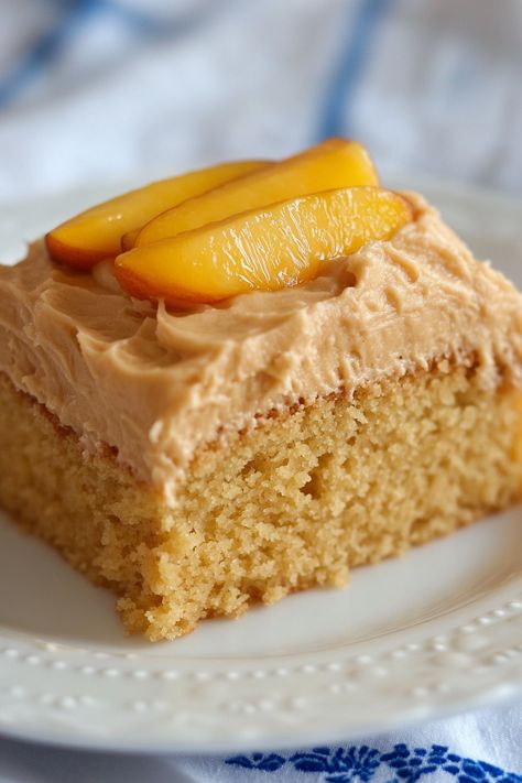 This Peach Cake with Brown Sugar Frosting can be enjoyed all year with fresh, frozen, or canned peaches. It's a breeze to prepare using a boxed cake mix, jello powder, and sliced peaches. Topped with a luscious brown sugar frosting that tastes like whipped caramel, each bite is a luxurious delight. Sometimes, you crave a Peach Cake With Brown Sugar Frosting, Peach Cake With Cake Mix Boxes, Whipped Caramel, Brown Sugar Frosting, Sliced Peaches, Sugar Frosting, Boxed Cake, Peach Cake, Canned Peaches