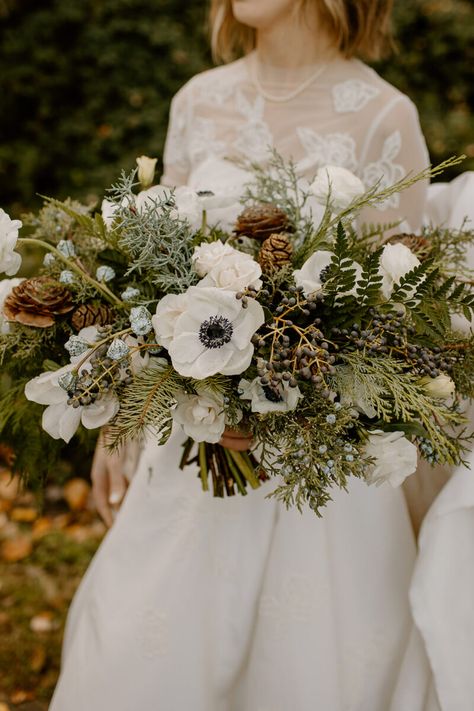 An Evergreen Winter Wedding At Axis Pioneer Square - Flora Nova Design - Premier Event Design Studio in Seattle Wedding Forest Flowers, Bridal Bouquet With Pinecones, Evergreen Bridal Bouquet, Pinecone Wedding Bouquet, Christmas Bouquet Wedding, Juniper Bouquet, Christmas Wedding Florals, Winter Flowers Aesthetic, Winter Bridesmaid Bouquet