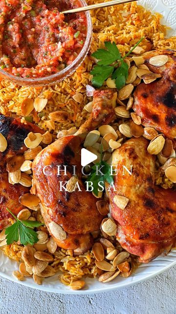 Taghrid Ahmad on Instagram: "Chicken Kabsa! A crowd pleaser perfect for Eid Al Fitr family gatherings. This traditional Saudi dish features a delicious spiced rice, using @SunRice Basmati Rice, topped with juicy flavourful chicken & served with a spicy tomato salsa! Here’s the full recipe 😋  #ad #ricenight #sunrice   Chicken Kabsa with Darqoos (spicy tomato salsa)   For the stock:   6 Maryland pieces of chicken 1 large diced onion  1 teaspoon garlic paste  1 teaspoon ginger paste  1 heaped tablespoon kabsa spices  2 chicken stock cubes  3 heaped tablespoons tomato paste  2 dried lime balls  Aromatics (cinnamon stick, bayleaf, cardamom pods) Salt   For the rice:   3 cups @sunrice basmati rice  1 diced onion 1 teaspoon garlic paste  1 teaspoon ginger paste  2 grated carrots  1 diced green c Kabsa Rice Recipe, Kabsa Recipe, Dried Lime, Cardamom Pods, Ginger Paste, Spiced Rice, Bridal Design, Garlic Paste, Eid Al Fitr