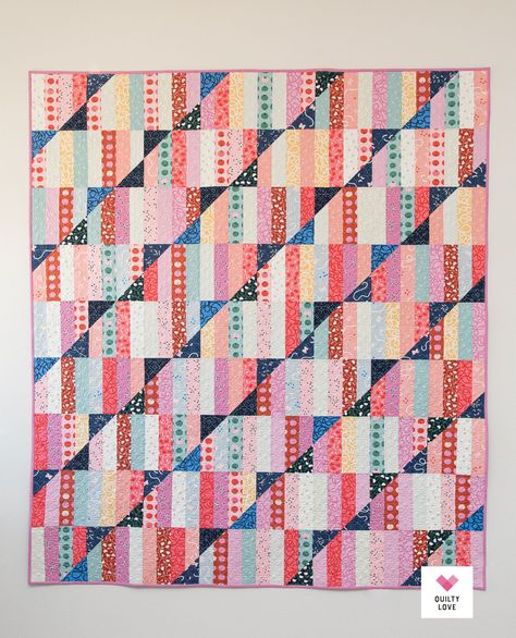 Happy Stripes is a jelly roll and a layer cake friendly quilt pattern from Emily Dennis of quiltylove.com. This pattern includes instructions for Baby, Small Throw, Medium Throw, Large Throw, Twin, Full, Queen or King size and includes two bonus patterns that you can make using the cut off half square triangles! It's a true stash buster! #modernquilt #quilting #happyquilt Happy Stripes Quilt, Quilt Beginner, Stripe Quilt Pattern, Machine Binding A Quilt, Stripes Quilt, Hearts Quilt, Quilty Love, Strip Quilt Patterns, Jelly Roll Quilt