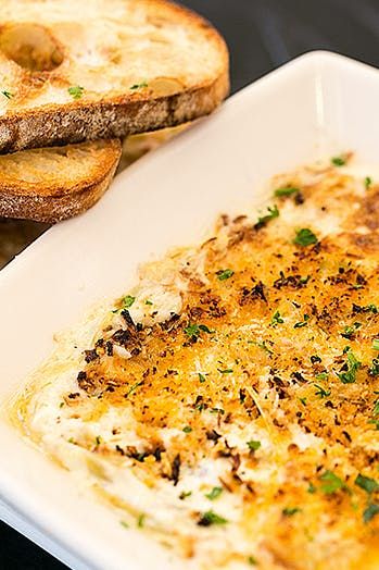 Cheesecake Factory Warm Crab and Artichoke Dip #purewow #seafood #appetizer #dips #summer #cooking #food #restaurants #copycat Crab And Artichoke Dip, Cheesecake Factory Recipes, Party Dip Recipes, Hot Crab Dip, Delicious Dips Recipes, The Cheesecake Factory, Party Dip, Crab Dip, Seafood Appetizers