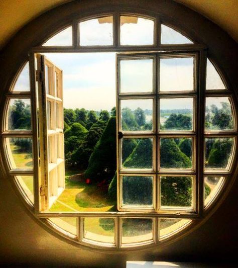 Peeking through a round window at Hampton Court Palace to the yew trees by Noleenwj on Instagram Round Window House Exterior, House With Circle Window, House With Round Windows, Door With Circle Window, Unique Windows Architecture, Large Round Window, Round Window Design, Circle Window Design, Round Windows Exterior