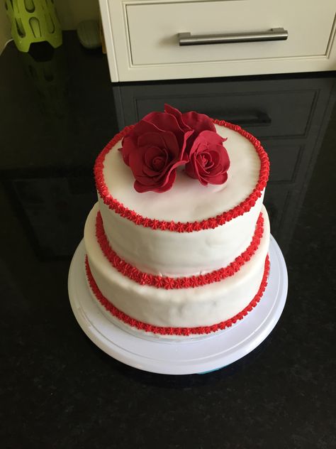 This is a 2-tier wedding anniversary cake. Bottom tier is red velvet and top tier is Victoria sponge. Beautifully topped with hand made sugarpaste roses. 3 Layer Red Velvet Cake, Red Cake Two Tier, Double Layer Red Velvet Cake, Red Velvet Cake Two Tier, Birthday Cake Red, Two Tier Red Velvet Wedding Cake, Half Birthday Cake, 2 Tier Cake, Wedding Anniversary Cake