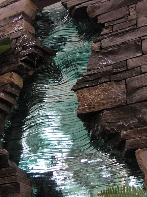 Stacked glass and stone Glass Waterfall, Water Sculpture, Feature Wall Design, Limestone Wall, Laminated Glass, Water Walls, Mosaic Ideas, Glass Sculptures, Glass Art Sculpture