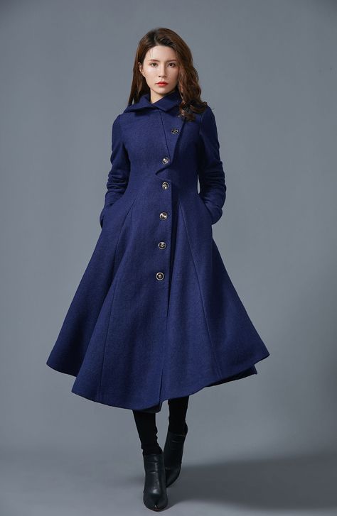 "FEATURES More colors click https://etsy.me/3jyUUtu 40% wool blend, 60% fiber, nylon Polyester lining Single breasted buttons closure Two side pockets Flared wool coat Asymmetric hem length Perfect for winter, autumn Dry clean ★★ The model's height approx 170 cm (5′ 7″) with the 84 cm (33\") bust, 66 cm (26\") waist. She is wearing a blue coat in size XS. ★★ Custom order selection, Will charge 20USD-70USD custom fees Request other color Request Chang the Length Request Chang the sleeve length Yo 40s Mode, Fit And Flare Coat, Hooded Wool Coat, Tailored Clothes, Tunic Designs, Wool Winter Coat, Wool Coat Women, Long Wool Coat, Blue Coat