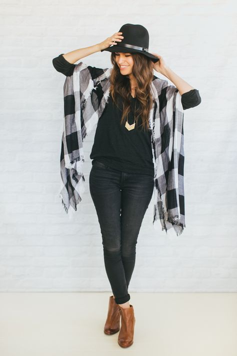 Black And White Scarf Outfit, Black White And Tan Outfits, Black Fedora Hat Outfit Fall, Black Fedora For Fall Festival, Western Black Fedora For Fall, Black And White Plaid Shirt Outfit, Casual Black Fedora For Festivals, Fedora Hat With Flannel Outfit, Flannel Poncho Outfit