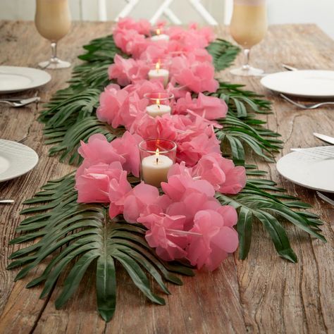 Lei" the table for a terrific tropical celebration! These table decorations bring a hint of Hawaii to your celebration, whatever the occasion. Perfect luau party supplies for a hula-themed bachelorette party or bridal shower, they're elegant, understated, and add instant atmosphere to any celebration space. (48 pcs. per unit)Includes:o 24 Polyester Large Palm Leaves (Leaf, 9" x 18"; stem, 5-1/2".)o 12 Plastic Light Pink Flower Leis (36" x 2 3/4" diam.)o 12 Clear Glass Votive Candle Holders with Candle (2 1/2")o Assortments are subject to change at any time and may vary from picture shown. Substituted items will be similar in nature. Simple Hawaiian Party Decorations, Cute Luau Party Ideas, Hawaii Party Table Decorations, Luau Theme Dessert Table, Summer Themed Decorations, Easy Tropical Centerpieces, Retro Miami Party Theme, Tropical Party Table Decorations, Tropical Pool Party Decor