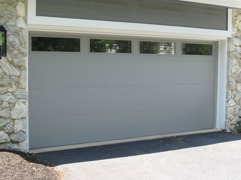 flush panel garage door with windows in grey Flush Panel Garage Door, Garage Door With Windows, Grey Garage Doors, Grey Garage, Slide Gate, Garage Door Replacement, Garage Door Panels, Garage Door Windows, Modern Garage Doors