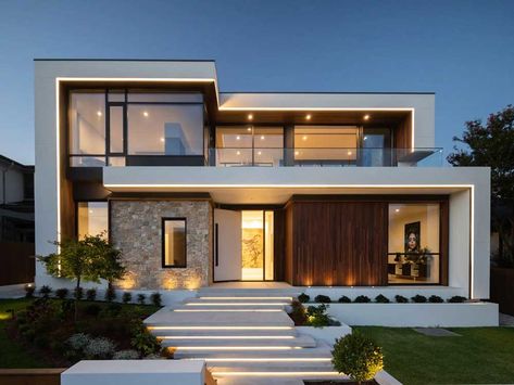 This project completely transforms the front of the house and entryway in both day and night by creating a bold and striking architectural feature. Modern Exterior House, Exterior House Design, House Design Trends, Modern Villa Design, Floating Stairs, Modern House Facades, Modern Exterior House Designs, House Construction Plan, Contemporary House Plans